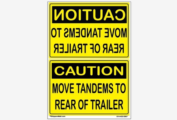 Caution Move wheels to rear of trailer sign w reverse text