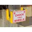 Wheel chock holder with sign "Chock Your Wheels". 